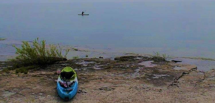 Sarah Hicks kayaks in Lake Erie after getting out of inpatient therapy for easting disorder treatment. 