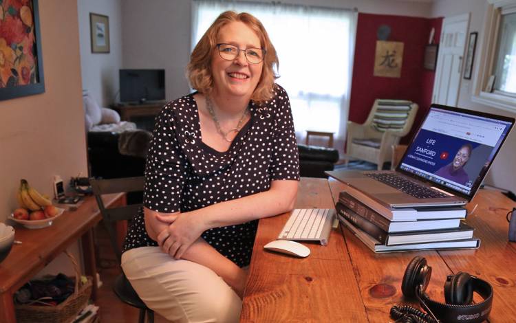 The Sanford School Public Policy's Carol Jackson improvised a workspace at her dining room table. Photo courtesy of Carol Jackson. Carol Jackson at her table.