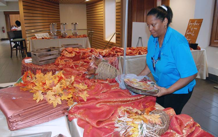 Food Service Manager Beverly Fullard tends to details prior to service. Photo by Stephen Schramm.