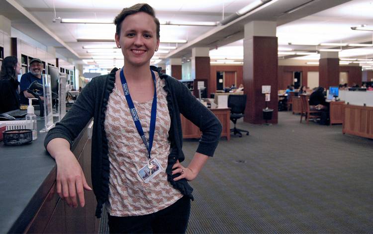 Perkins Library Access and Library Services Coordinator Kelli Stephenson helps the students who pack Perkins Library get what they need. Photo by Stephen Schramm.