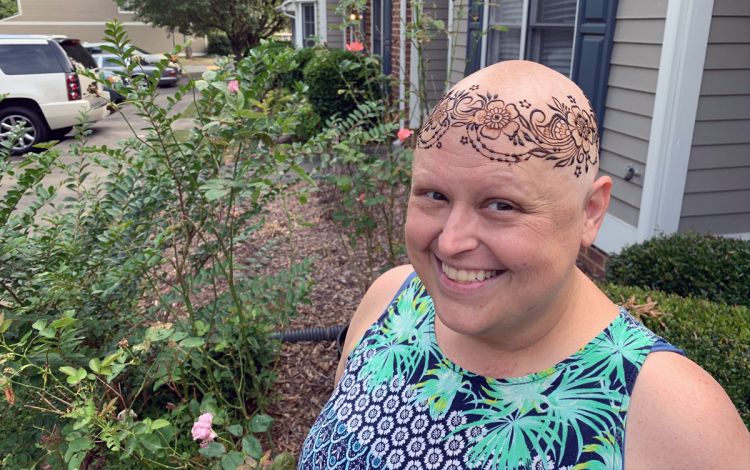 A woman with a design on her head.