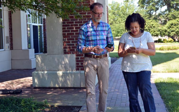 Associate Dean of Students and Director of DuWell Tom Szigethy, left, and School of Nursing Clinical Research Coordinator Maralis Mercado Emerson, right, are among the 16,200 who have downloaded the LiveSafe app.