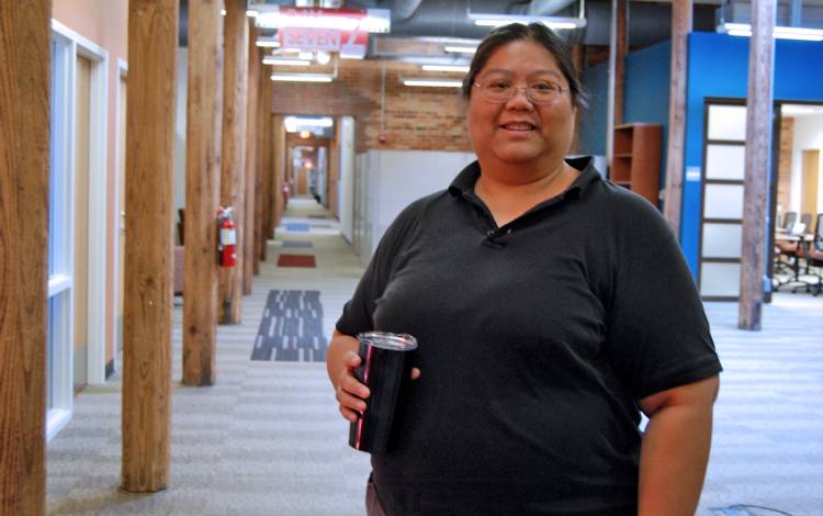 Lyn Francisco makes it a point to walk around her Smith Warehouse workspace several times a day in order to keep her energy up. Photo by Stephen Schramm.