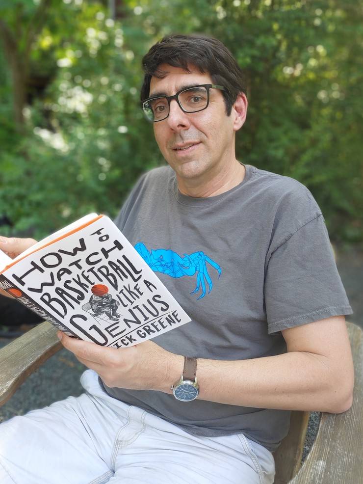 Mark Borsuk reads How to Watch Basketball Like a Genius. Photo courtesy of Mark Borsuk.