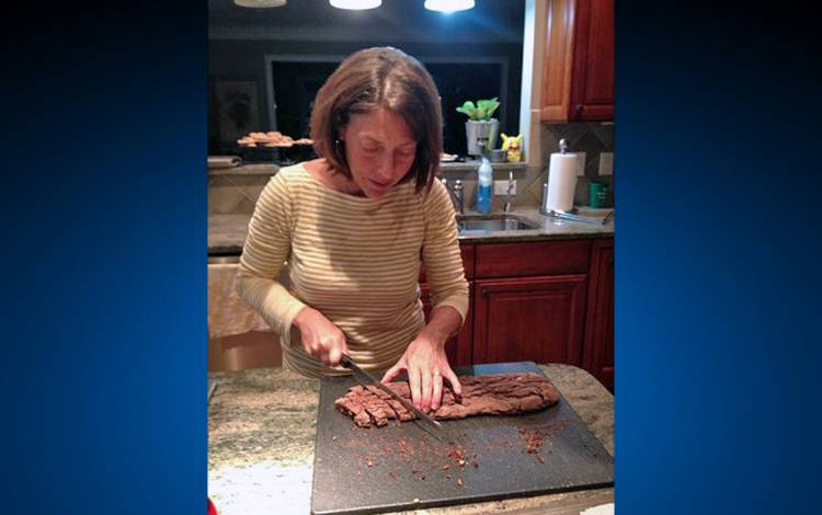 Meredith Bolon slices biscotti. Photo courtesy of Meredith Bolon.