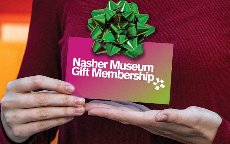 Hands holding a gift card.