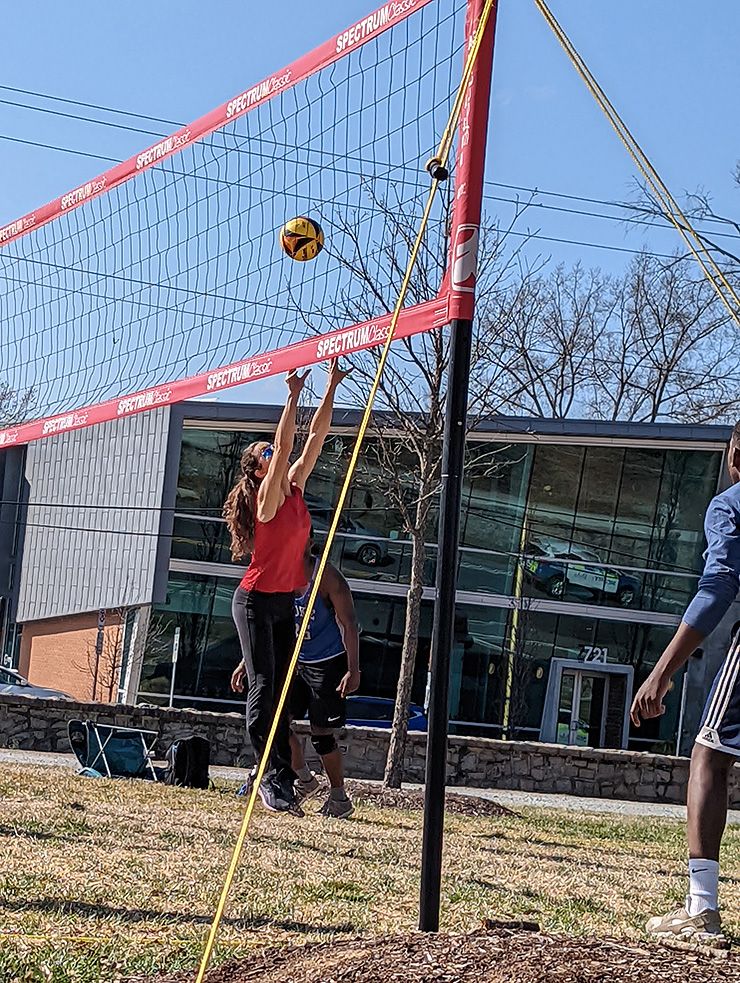 Emily Ozdowski routinely plays volleyball at the East Campus outdoor courts, and can be seen here setting the ball. Photo courtesy of Alexandra Ozdowski. 