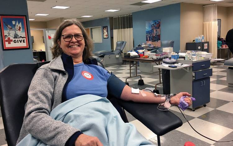 Peggy Eren, a nurse practitioner for Duke Hematologic Malignancies & Cell Therapy, donates blood in March to help pandemic efforts.