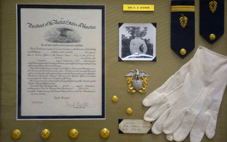 Bull City Art & Frame Company framed Darell Bigner's memorabilia from his career in the Navy Medical Corps. Photo by Jonathan Black.