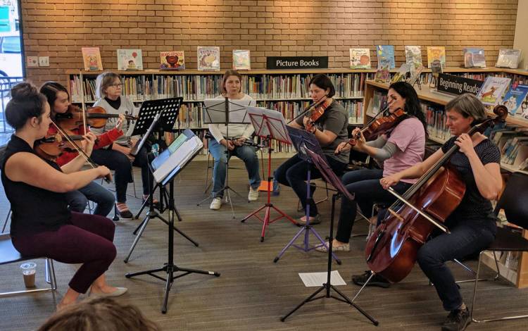 Klugh Jordan, far right, plays the cello in the Really Terrible Orchestra of the Triangle, a group for amateur musicians. Photo courtesy of Klugh Jordan. 