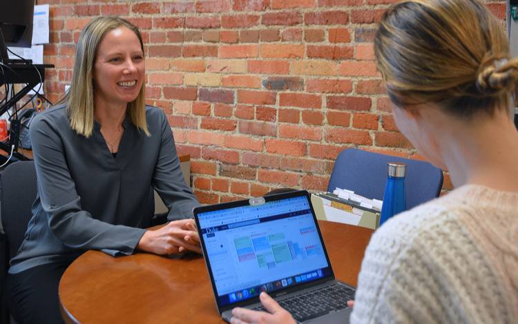 Rachel Coleman, left, helps graduate students to prepare for job interviews. Photo by Jonathan Black.