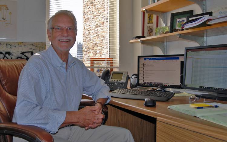 Wiley Schell enjoys the same view of campus from the window of his Sands Building office that Nobel laureate Robert Lefkowitz appreciated when the workspace was his years ago. Photo by Stephen Schramm.