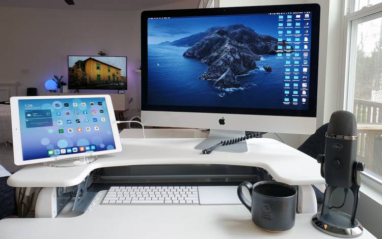 A desk with a computer.