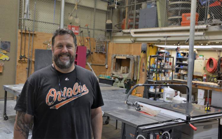 David Berberian, assistant manager of the Scene Shop, works with wood, steel and canvas fabric to build sets. Photo by Jonathan Black.