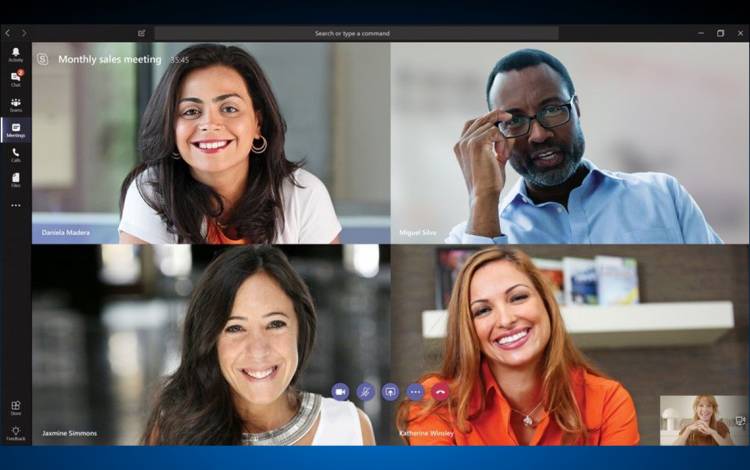 Four people on a video call.