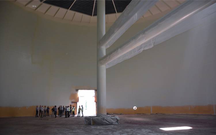 Attendees explore the inside of the Chilled Water Thermal Storage Tank during a tour led by Russell Thompson, director of Utility & Engineering Services in Facilities Management. Photo by Stephen Schramm. 