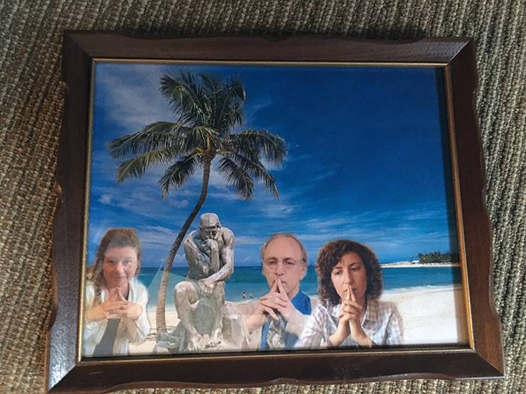 William Meyer covers his office walls with framed photos of his social work interns, including this photoshopped image of the group of them at a beach.