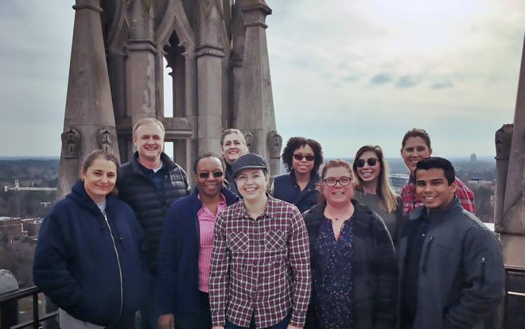The Karsh Office of Undergraduate Financial Support poses atop Duke University Chapel.