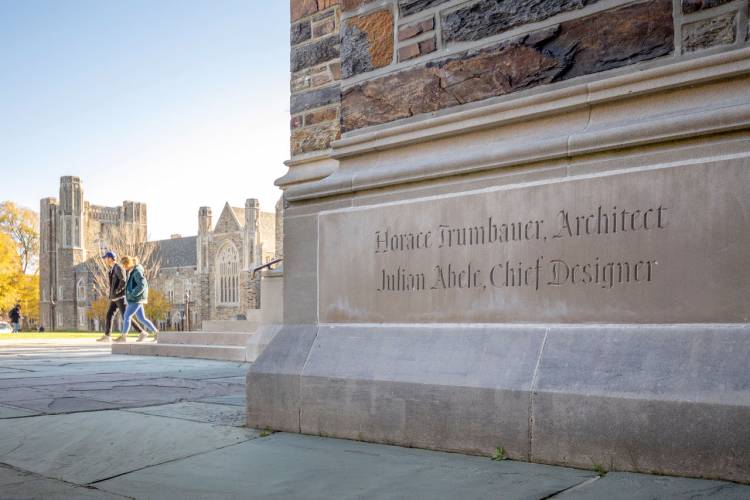 The Duke Chapel cornerstone commemorating Trumbauer and Abele. It faces the Divinity School. Photo by William Snead.