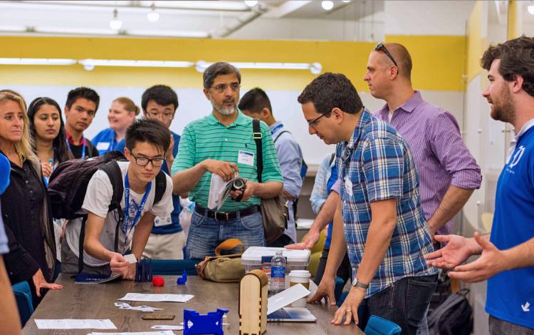 Michael Faber, second from right, and his team are figuring out the next steps for the Duke Innovation Co-Lab’s Roots program, which offers workshops on a range of technology-related topics.