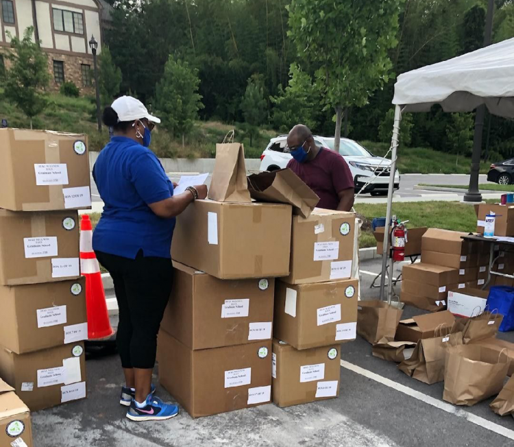 Graduate School staff members are holding a drive-through distribution this morning for departments to pick up masks, DukeCards, and wellness bags for their graduate students.