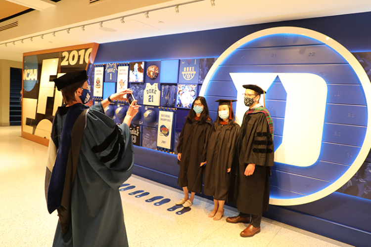 The Nicholas School student made the best use of the Cameron Indoor Stadium facility to celebrate graduation.