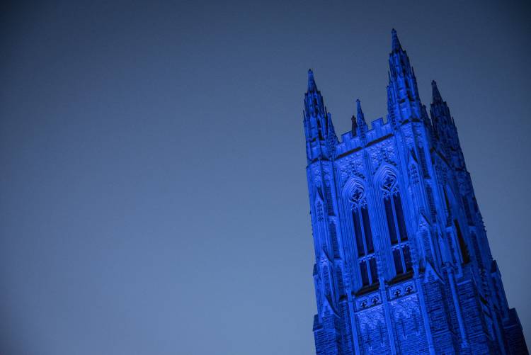 Duke Chapel is bathed in blue light to celebrate the inauguration of Vincent Price, the tenth president of Duke University. 