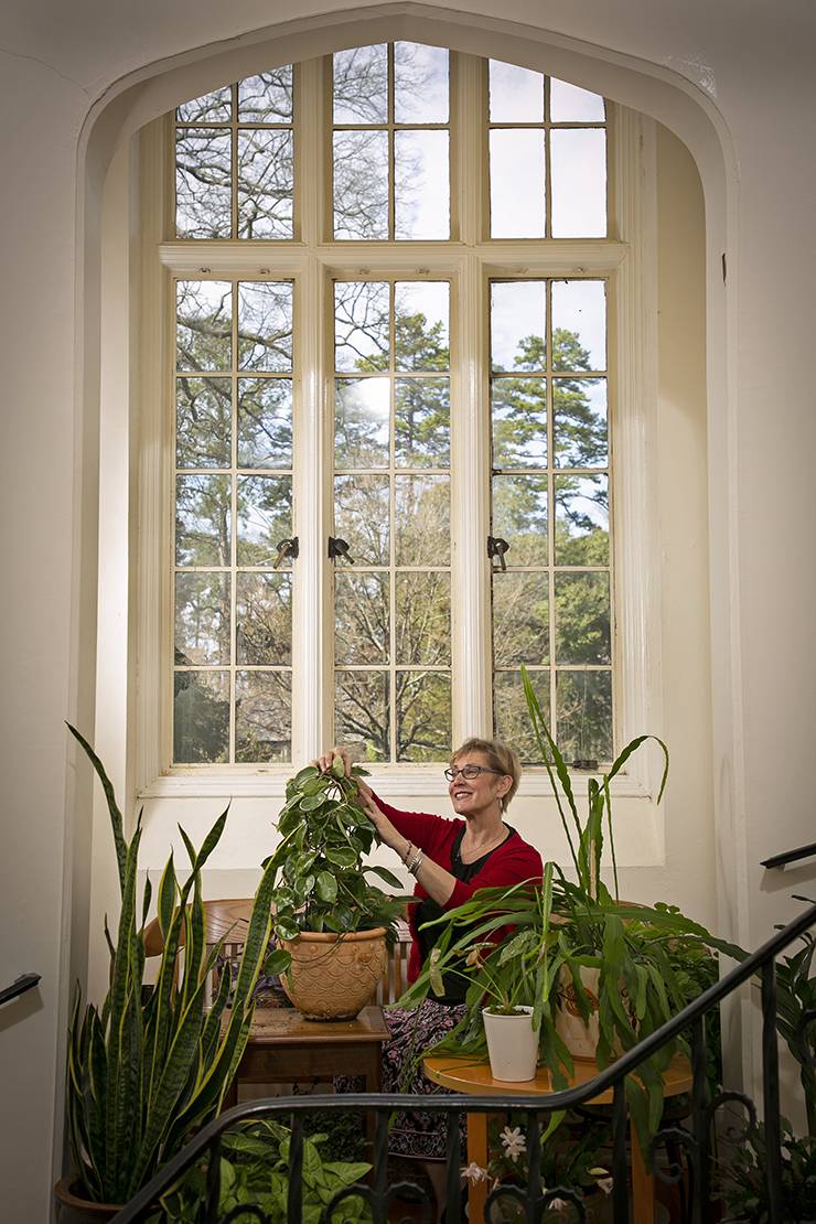 Lynette Roesch, Duke Graduate School staff assistant, tends to plants. Photo by Chris Hildreth.