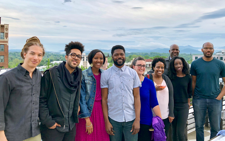 WRAP members build community at the Durham Hotel. (From left: Tyson Brown, Gustavo Silva, Sherilynn Black, Jarvis McInnis, Sarah Gaither, Jean Beaman, Sally Nuamah, Robert Turner, Paul Robbins)