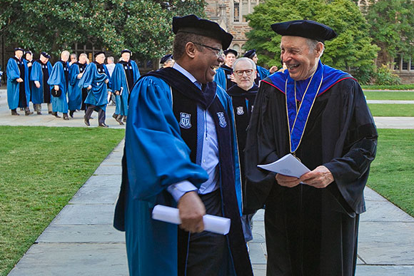 Horst Meyer, right, talks with Duke Trustee Daniel Blue Jr. before the 2014 Founders' Day ceremony. Photo: Duke Photography