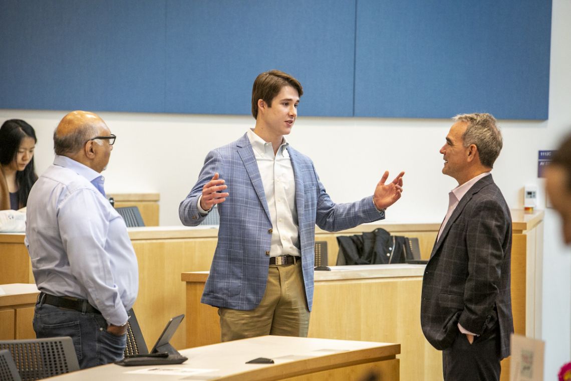 Haroon Inam, Michael Wood III and Brian Murray talk at the climate podcast discussion.