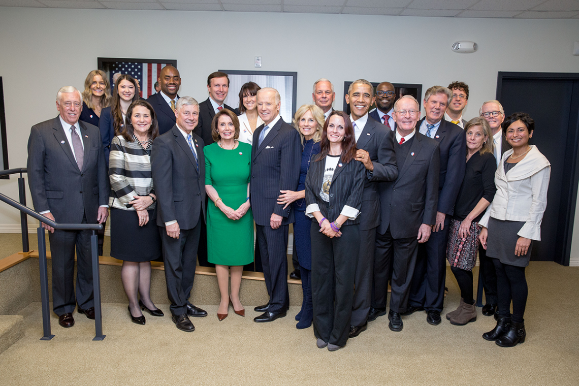 Kafui joined President Barack H. Obama and bipartisan congressional leadership for the signing of the 21st Century Cures Act on December 13, 2016. He is pictured betwee