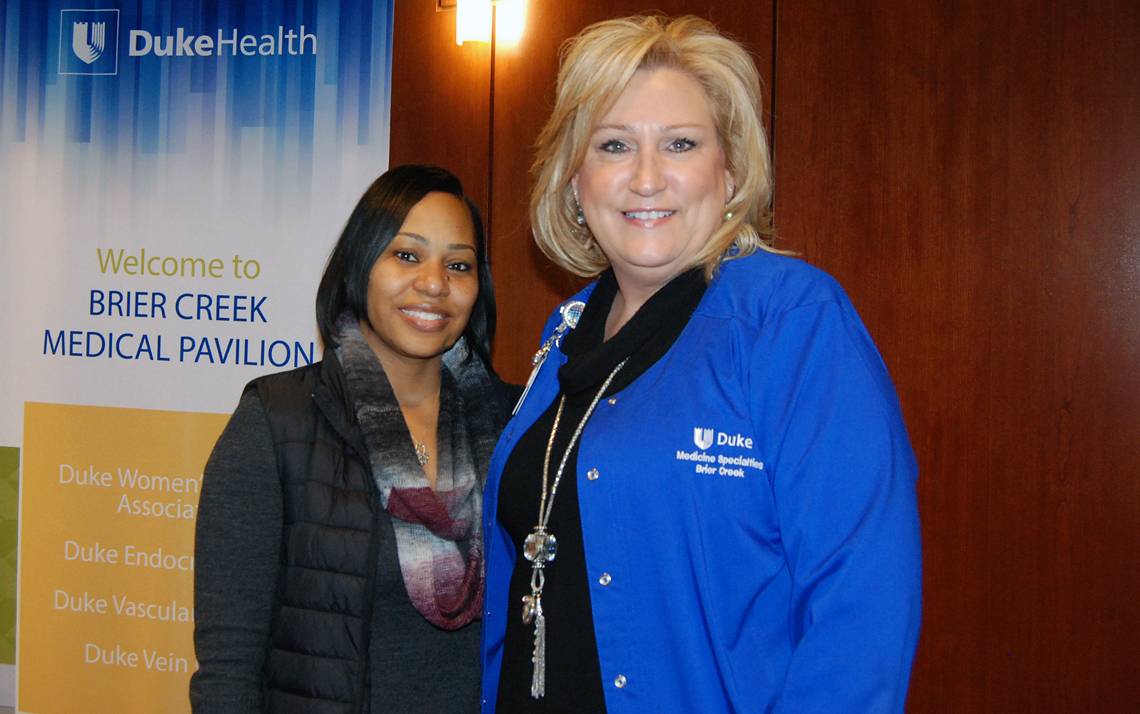 Teunille Irons, left, and Mary Beth Fry, right, of Duke Specialty Clinics at Brier Creek go to great lengths to look after patients. Photo by Stephen Schramm.