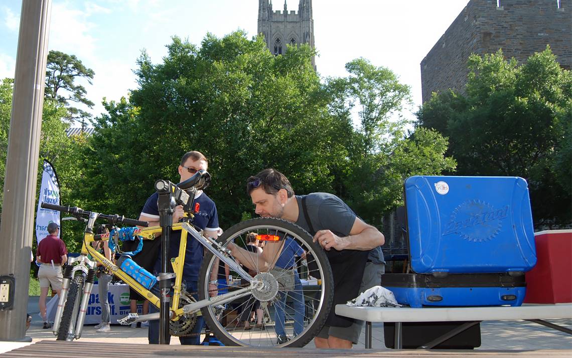 David Loschiavo, owner of Durham Cycles, works on a bike at a Duke Bicycle Appreciation Breakfast in 2017. Photo by Stephen Schramm. 