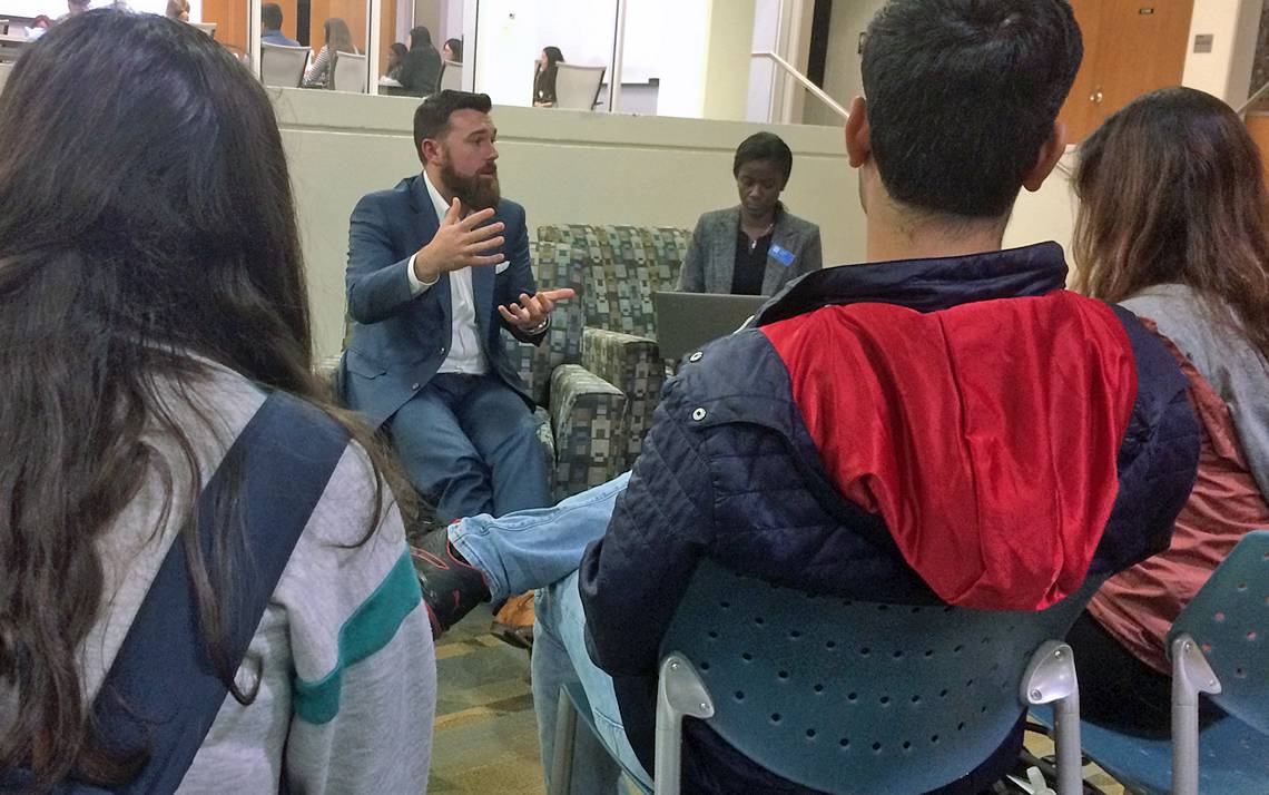 Duke Facilities Management Energy Manager Casey Collins speaks with members of the Duke community at Thursday's Climate Action Plan forum. Photo by Stephen Schramm.