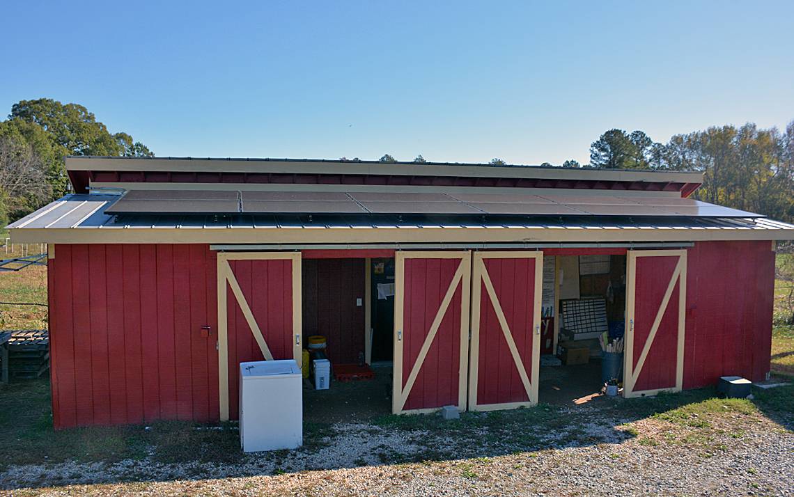 A dozen solar panels line the roof of Duke Campus Farm's barn. Photo by Jonathan Black.