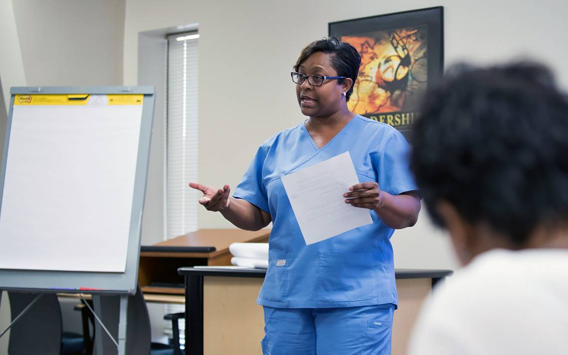 Duke quality assurance technician Karla Washington presents about pharmacy hand hygiene to Duke's Learning & Organization Development classmates.