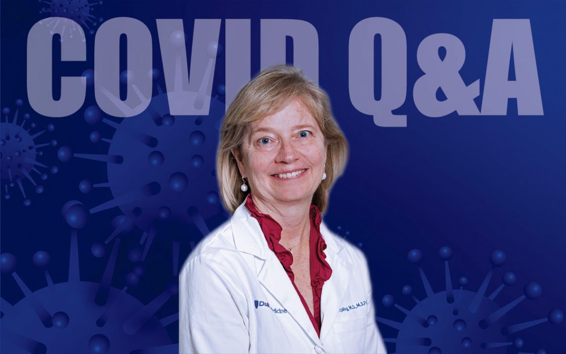 Carol Epling in front of a blue background.