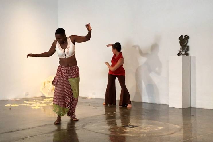 Aya Shabu and Dasha Chapman perform a narrative dance of Durham's history.