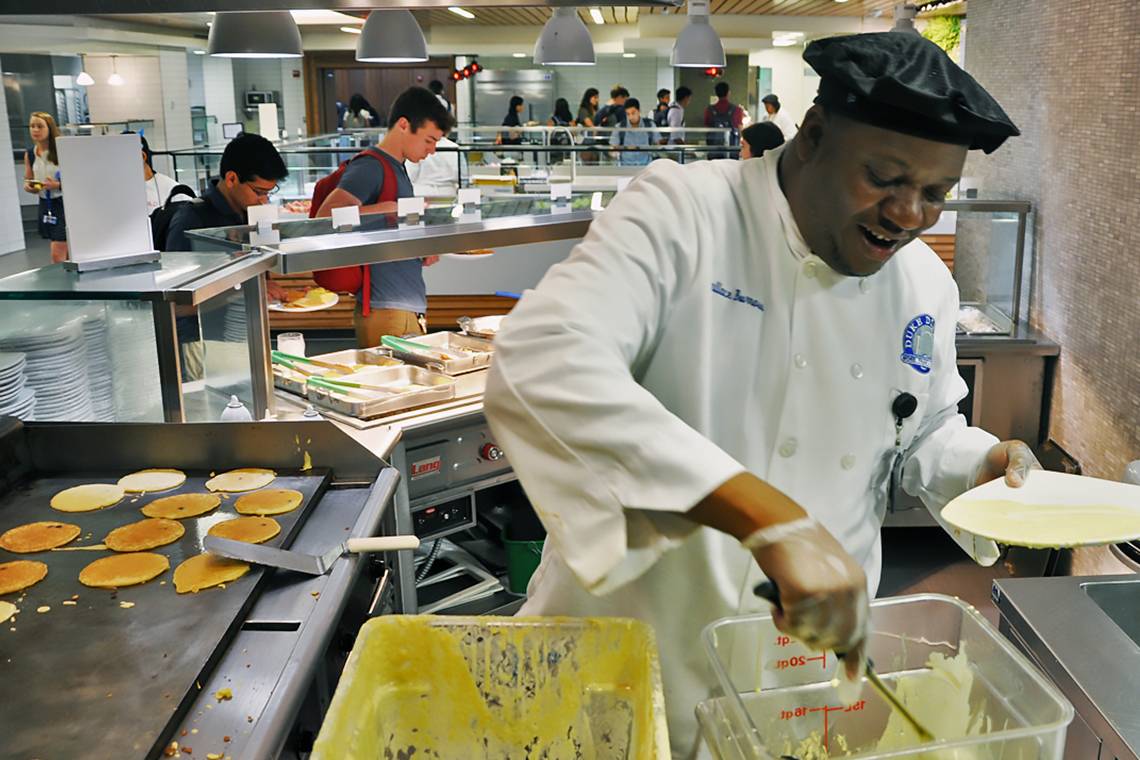 Duke Dining's Wallace Burrows makes pancakes Monday morning in the East Campus Marketplace.