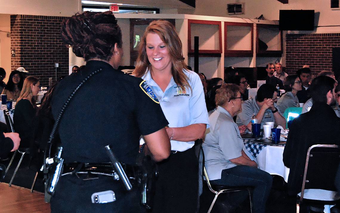 Duke University Hospital's Rhonda Tilley accepts her certificate after completing the Alumni Citizens' Police Academy on Friday. Photo by Stephen Schramm.