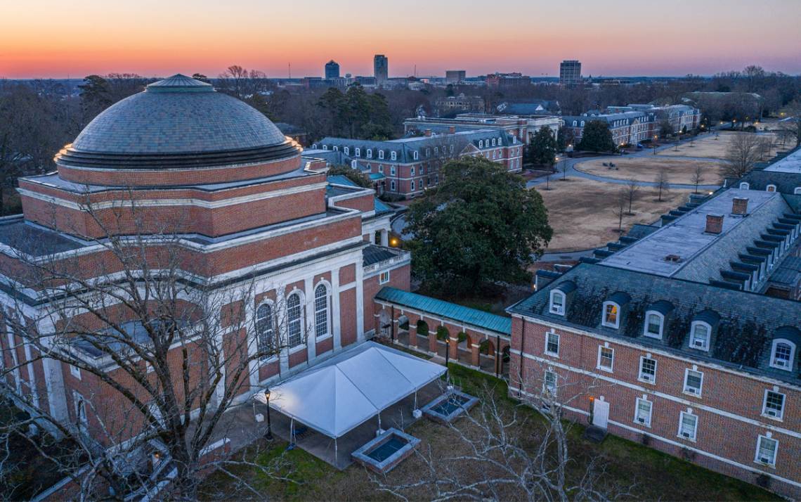 The sun rises over East Campus and downtown Durham. Photo courtesy of University Communications.