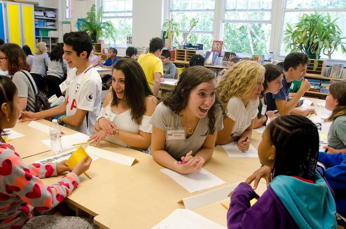 Duke student Catherine Oliver and other students in the Knowledge in the Service of Society FOCUS cluster work with students at Watts Elementary School. Photo by Susie Post-Rust.