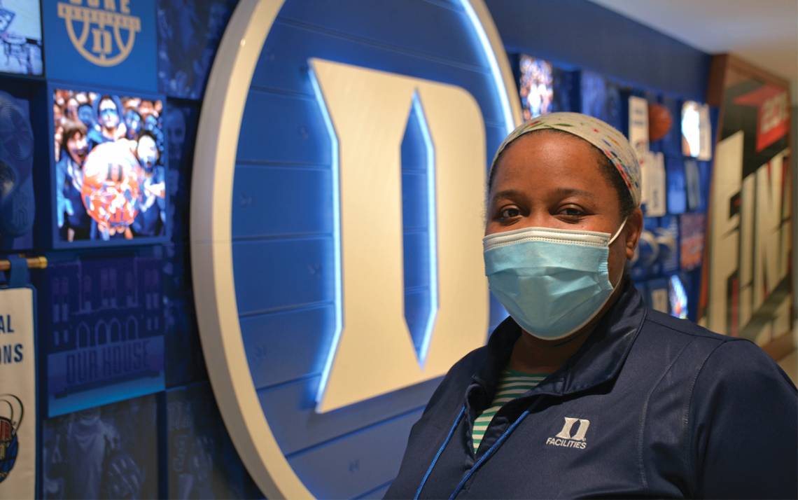 LaShawnda Harris of Duke University Environmental Services stands in Cameron Indoor Stadium. Photo by Stephen Schramm.