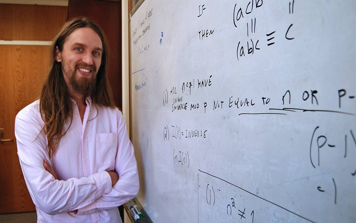 Matt Junge in front of a whiteboard.