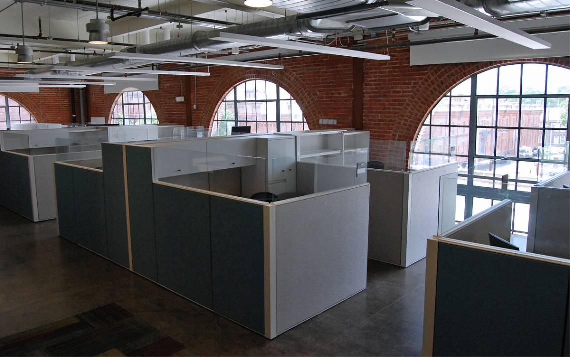 Workspaces in downtown Durham's Powerhouse are available for Duke OIT employees as part of a remote work pilot program. Photo by Stephen Schramm.
