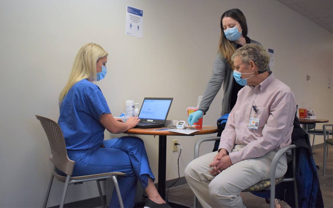 Duke Raleigh Hospital's Scott Gersh receives his first dose of the COVID-19 vaccine in December. Photo by Shawn Rocco.