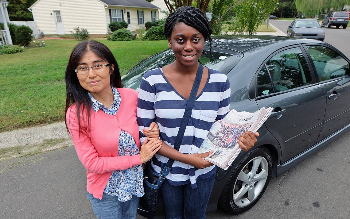 Natasha Graham, right, delivers copies of the Durham Voice. Photo by Jock Lauterer, founding publisher of the Durham Voice and Senior Lecturer Emeritus at the School of Media and Journalism at the University of North Carolina.