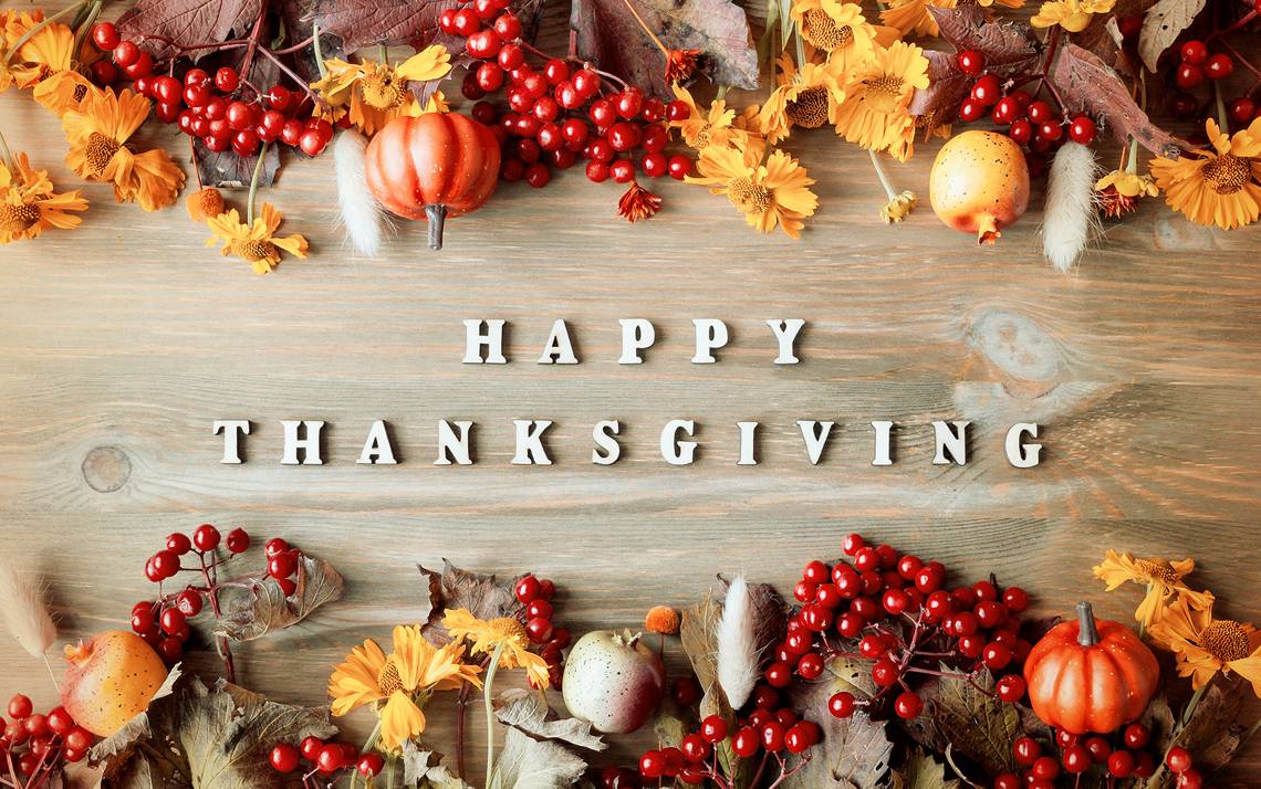 Leaves on top of a Happy Thanksgiving message.