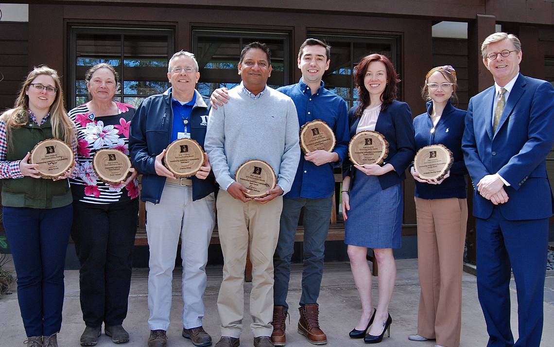 Duke Sustainability Award winners, from left to right, Belle Farish, Susan Jackson, Charlie Perez, Abhi Bathula, John Desan, Trisha Dupnock, Amanda Starling Gould and Duke University President Vincent E. Price. Photo by Stephen Schramm.